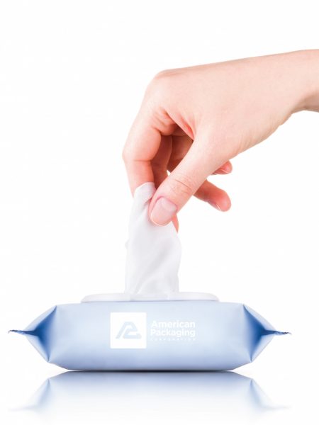 Hand Pulling a Tissue Out of a Box